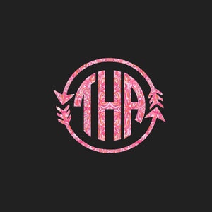 May include: Pink monogram with the letters "THA" in a circle with a pink and white floral pattern. The circle has two arrows on either side.