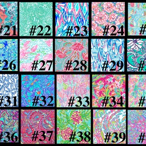 May include: A collection of 40 different colorful patterned fabric swatches. Each swatch is numbered from 21 to 40.