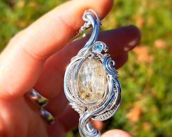 Golden rutile, moonstone sterling silver pendant.