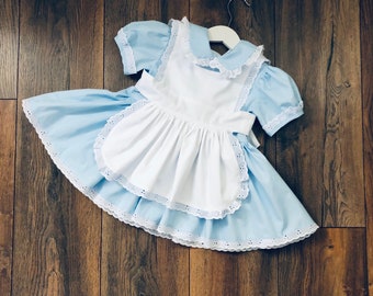 Hand made Alice inspired dress. Baby blue  dress with apron. Girls dress with white apron. Birthday dress. Onederland