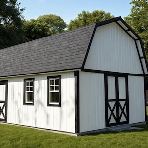 A white barn shed with grey trim. A single door and 2 windows on the side with a double door on the end. Set in a grassy backyard with a fence and landscaping. Great storage solution for any homeowner.