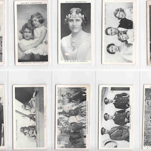 May include: A collection of black and white trading cards featuring images of the British Royal Family, including Queen Elizabeth, King George VI, and the Royal Princes. The cards are from the Will's Cigarette series.