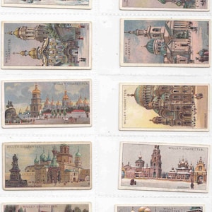 May include: A set of vintage cigarette cards, each displaying an illustration of a building. The cards, branded with "WILLS'S CIGARETTES", showcase diverse architectural styles, including churches and other structures, with a historical aesthetic.