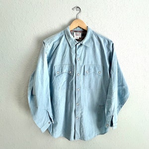 Calvin Klein blue chambray pearl snap shirt