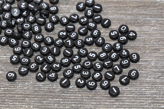 Perline con numeri neri, Perline con numeri neri acrilici, Perline  acriliche rotonde in plastica, Perline nere con numeri bianchi, Misura 7mm  97 -  Italia
