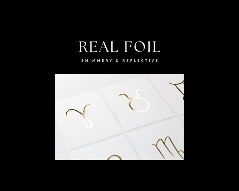 May include: Gold foil zodiac signs on white cards. The signs are Aries, Taurus, Gemini, Cancer, Leo, Virgo, Libra, Scorpio, Sagittarius, Capricorn, Aquarius, and Pisces.