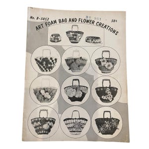 May include: Vintage craft pattern titled "Art Foam Bag and Flower Creations." The cover features illustrations of various floral-decorated foam bags and accessories. The bags have handles and are adorned with different flower designs.