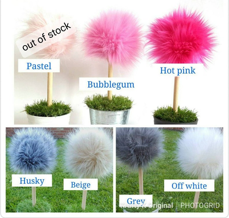 May include: A collection of decorative faux fur pom-pom trees on wooden dowels, each set in a small pot with artificial grass. Colors include pastel, bubblegum, hot pink, husky blue, beige, grey, and off-white. Text labels identify each color.
