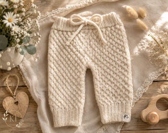 Hand-knitted alpaca baby pants, soft and warm, perfect as a baby gift for a newborn or as part of a Scandinavian baby wardrobe.