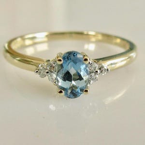 9ct Gold Diamond and Pale Blue Topaz Ring