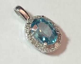 Basic Halo Oval Genuine 1.20 Ct Blue Zircon With 4 Natural Diamond Pendant in 10kt White Gold With 10k 18" 6R Chain Also Birthstone Series