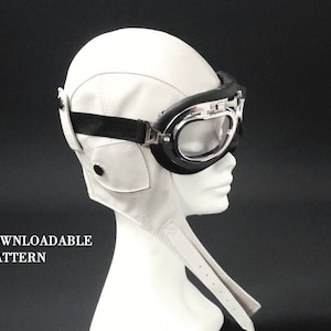 May include: White leather aviator helmet with a black strap and silver goggles.  PDF DOWNLOADABLE PATTERN.
