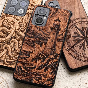 May include: Three phone cases with wood-grain textures and laser-engraved designs. The centre case features a lighthouse on a rocky shore with crashing waves. The left case shows an octopus with tentacles, and the right case displays a compass rose.