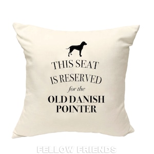 May include: White throw pillow with black text that reads "This seat is reserved for the Old Danish Pointer". A black silhouette of a dog is above the text.