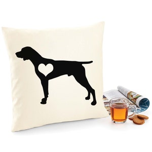 May include: A white throw pillow with a black silhouette of a German Shorthaired Pointer dog with a white heart in its chest.