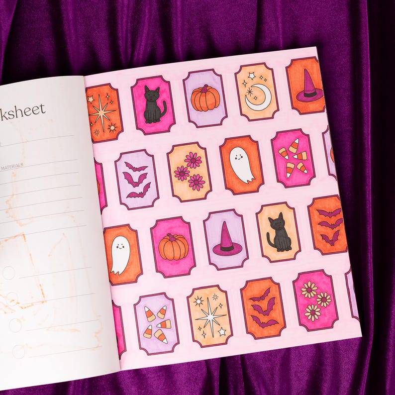 May include: Open book with a pink page featuring Halloween-themed illustrations. The illustrations include a black cat, pumpkins, ghosts, bats, and witch hats. The illustrations are in orange, pink, and purple.