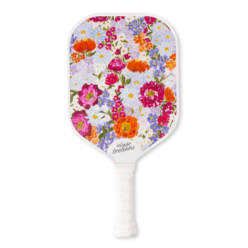 May include: A white pickleball paddle with a vibrant floral design featuring pink, orange, and purple flowers. The paddle has a white handle with a textured grip and the text "elyse breanne".