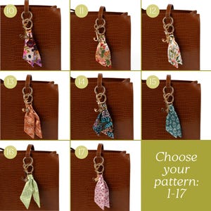May include: A collection of patterned silk scarf keychains hanging from a brown leather bag. The scarves feature various floral and geometric designs in colors like pink, blue, green, and orange. The text "Choose your pattern: 1-17" is also visible.