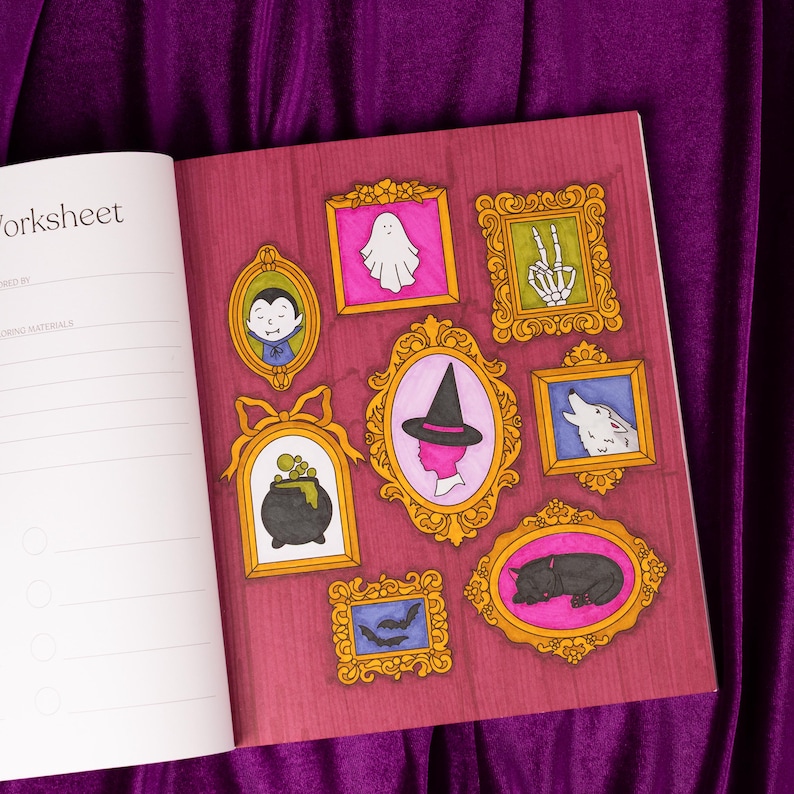 May include: Open notebook with a worksheet page and a decorative page featuring framed Halloween-themed illustrations. The illustrations include a ghost, skeleton hand, vampire, witch, cauldron, wolf, bats, and a black cat.