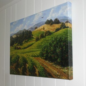 May include: A painting of a vineyard landscape with rolling hills, green vines, and a small house in the distance. The sky is blue with white clouds and a bird flying overhead.
