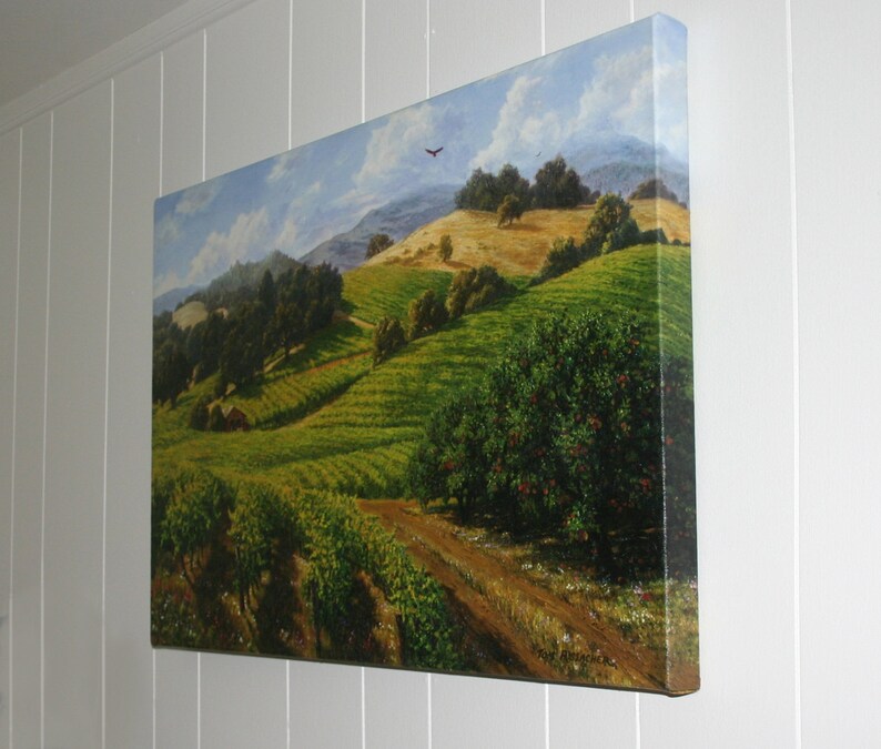 May include: A painting of a vineyard landscape with rolling hills, green vines, and a small house in the distance. The sky is blue with white clouds and a bird flying overhead.