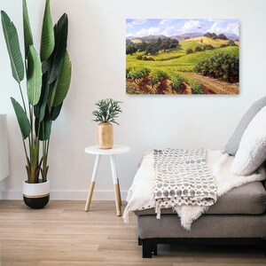 May include: A painting of a vineyard landscape with rolling hills, green vines, and a blue sky with white clouds. A small red airplane flies in the distance.