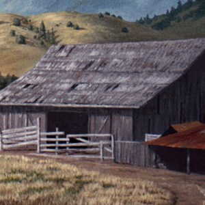 May include: A weathered wooden barn with a gray roof and a rusty metal roof extension. The barn is surrounded by a wooden fence and is set against a backdrop of rolling hills.