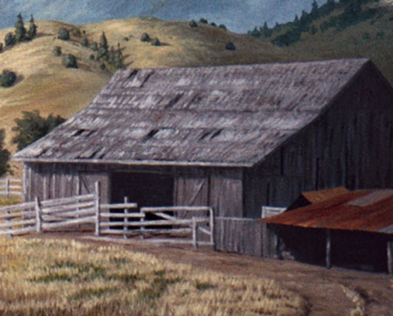 May include: A weathered wooden barn with a gray roof and a rusty metal roof extension. The barn is surrounded by a wooden fence and is set against a backdrop of rolling hills.