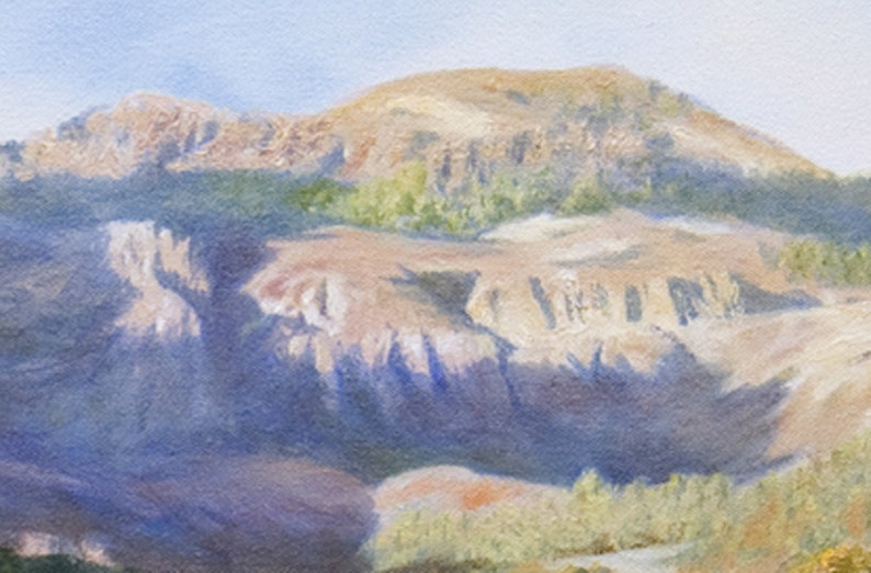 May include: An oil painting of a mountain landscape under a pale blue sky. The mountain is painted in shades of tan and brown, with touches of green vegetation. Shadows create depth, giving the scene a sense of dimension and perspective.