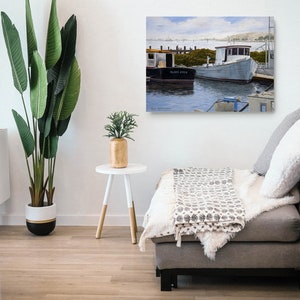May include: A painting of two boats docked at a pier. The boat on the left is black and says "Blind Luck" on the side. The boat on the right is white and has a blue roof. The painting is set against a blue sky with white clouds.