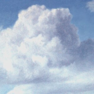 May include: A large, fluffy white cloud against a light blue sky.