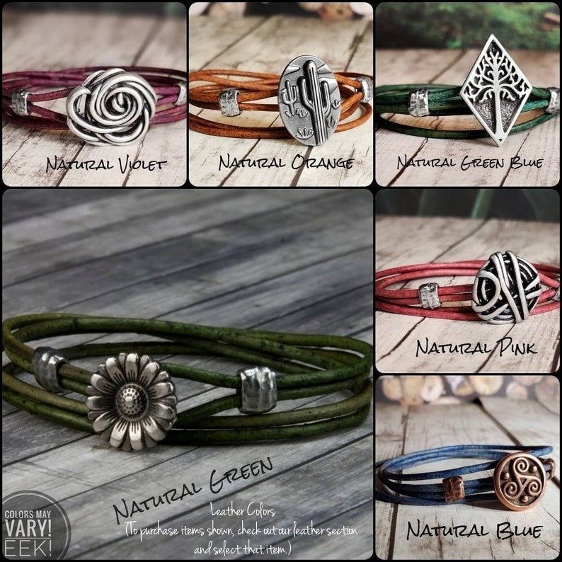 May include: A collage of ten leather bracelets with different colored leather and metal charms. The charms include a rose, a cactus, a tree, a swirl, a flower, and a Celtic knot. The text "Colors May Vary! Eek!" is in the bottom left corner. The text "Natural Violet, Natural Orange, Natural Green Blue, Natural Pink, Natural Green, Natural Blue" is below each bracelet.