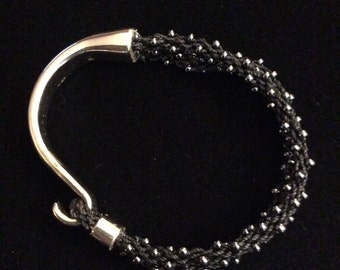 Black and silver tone beaded bracelet