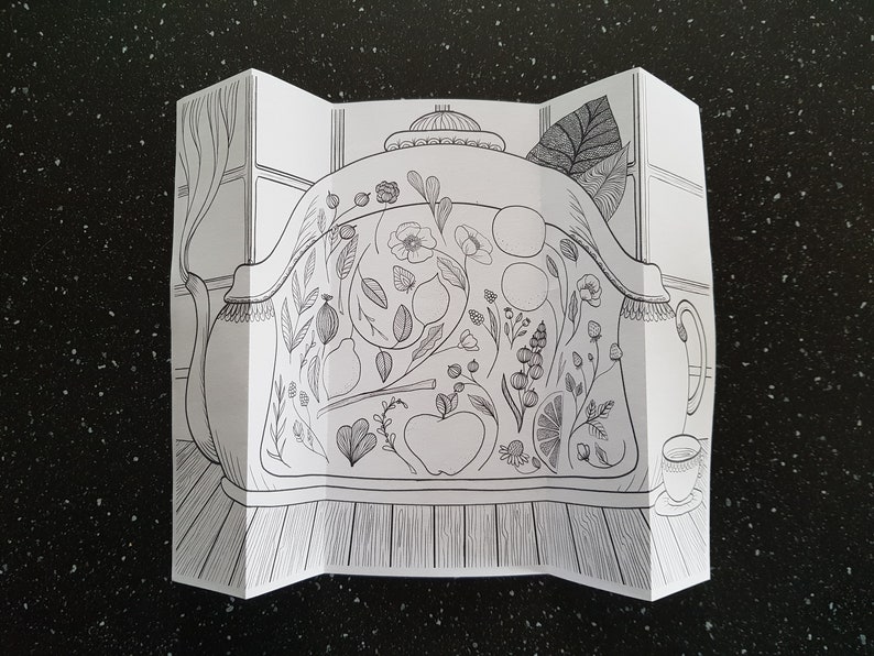 May include: A black and white line drawing of a teapot with a floral design. The teapot is on a table with a cup and saucer.