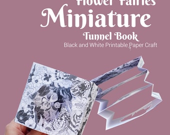 May include: Black and white printable paper craft of a flower fairy miniature tunnel book. The book is open to reveal the intricate details of the design. The book is 7 cm or 9.5 cm in size.