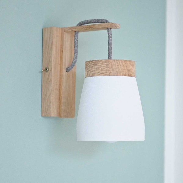 Wall lamp for wall outlet in dark grey or white