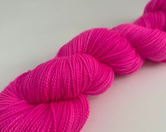 Hand dyed neon pink yarn sock weight, sock yarn dyed in merino wool and nylon in a fun neon pink