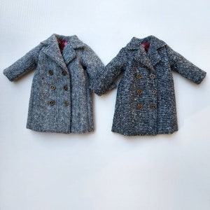 May include: Two gray tweed double-breasted coats with gold buttons.