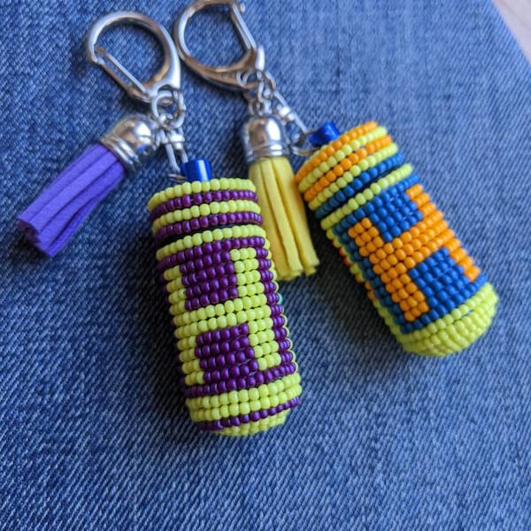 Personalizable Beaded portable pill holder keychain with a letter on a square + cute flowers in the back. Choose your colors. Pill box