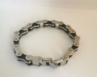 Stylish man's silver bike link chain bracelet comes ready packaged in a velvet pouch.