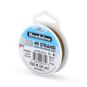 May include: A spool of Beadalon 49 strand bead stringing wire in satin gold. The label indicates a diameter of .015 inches, a length of 100 feet, and a break strength of 13 pounds. The packaging features a white plastic hanger and blue accents.