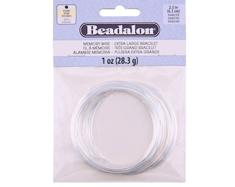May include: A package of silver memory wire for jewelry making. The wire is 2.5 inches in diameter and comes in a 1 ounce package. Beadalon is the brand name.