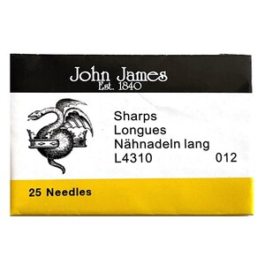 May include: A package of John James sewing needles. The black and yellow package features the brand name and a dragon emblem. Text on the package includes "Sharps", "Longues", "Nähnadeln lang", and "25 Needles".