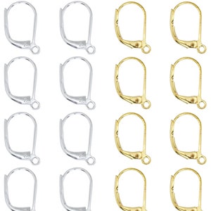 May include: A set of 12 earring hooks, 6 silver and 6 gold. The hooks are made of metal and have a simple, classic design.