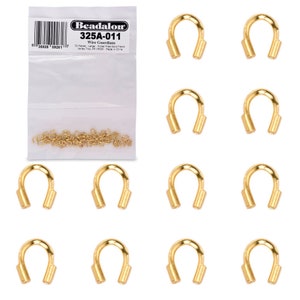 May include: A package of 72 gold-plated wire guardians, also known as crimp covers, for jewelry making. The package label reads "Beadalon 325A-011 Wire Guardians 72 Pieces Large Nickel Free Gold Plated Value Two 19320 Made in China".