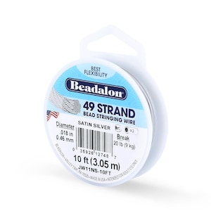 May include: A spool of Beadalon 49 Strand bead stringing wire in satin silver. The package indicates a diameter of .018 inches (0.46 mm) and a break strength of 20 lb (9 kg). The spool contains 10 ft (3.05 m) of wire.