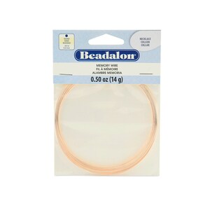 May include: A package of Beadalon memory wire, 0.50 ounces (14 grams), for making necklaces or bracelets. The wire is gold-colored and is coiled in a circle.