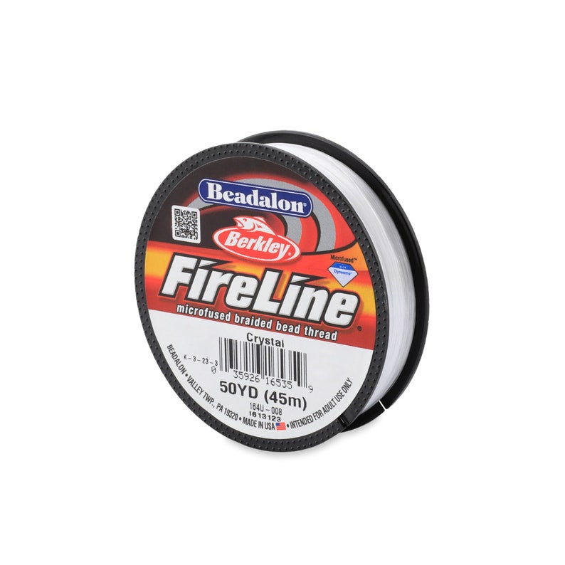 May include: A spool of white Beadalon FireLine microfused braided bead thread. The label reads "Crystal" and "50YD (45m)".