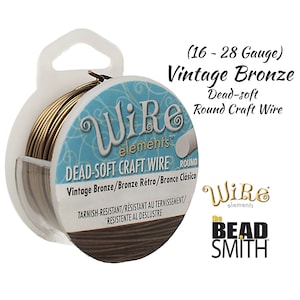 Peut inclure: Bobine de fil de cuivre rond souple de couleur bronze vintage, calibre 16-28. L'emballage porte les logos "Wire Elements" et "The Bead Smith". Le fil est résistant au ternissement.