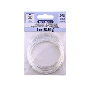 May include: A spool of silver memory wire, 1 ounce (28.35 grams), with a 2.25 inch (5.7 cm) diameter. The wire is designed for making large bracelets.